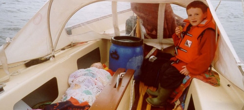Marion fast asleep (it was raining) Simeon eating a biscuit