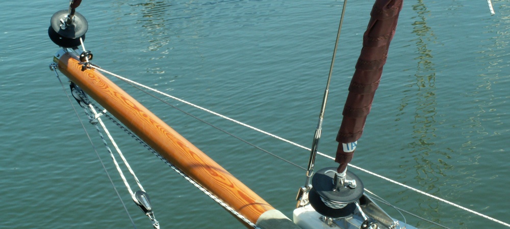 Where the rope exits the furler via a bullseye on the bowsprit its mounting blate can chafe the varnish. A plate prevents this.