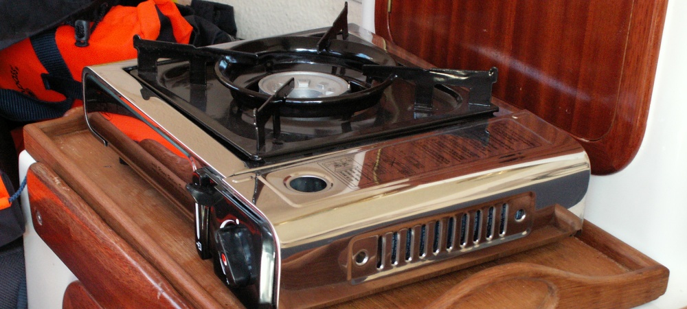 Camping stove. This is a stainless version of those seen in most outdoor shops. Bonded to a tray- may be used in the cockpit as well. I also have 2 Coleman petrol cookers. These are awesome!